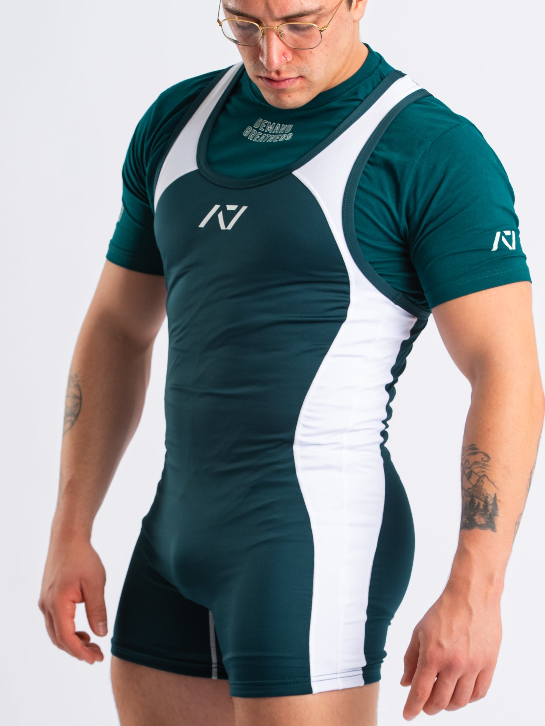 A7 IPF Approved Emerald Forás Luno singlet features extra lat mobility, side panel stitching to guide the squat depth level and curved panel design for a slimming look. The Women's cut singlet features a tapered waist and additional quad room. The IPF Approved Kit includes Luno Powerlifting Singlet, A7 Meet Shirt, A7 Zebra Wrist Wraps, A7 Deadlift Socks, Hourglass Knee Sleeves (Stiff Knee Sleeves and Rigor Mortis Knee Sleeves). All A7 Powerlifting Equipment shipping to UK, Norway, Switzerland and Iceland.