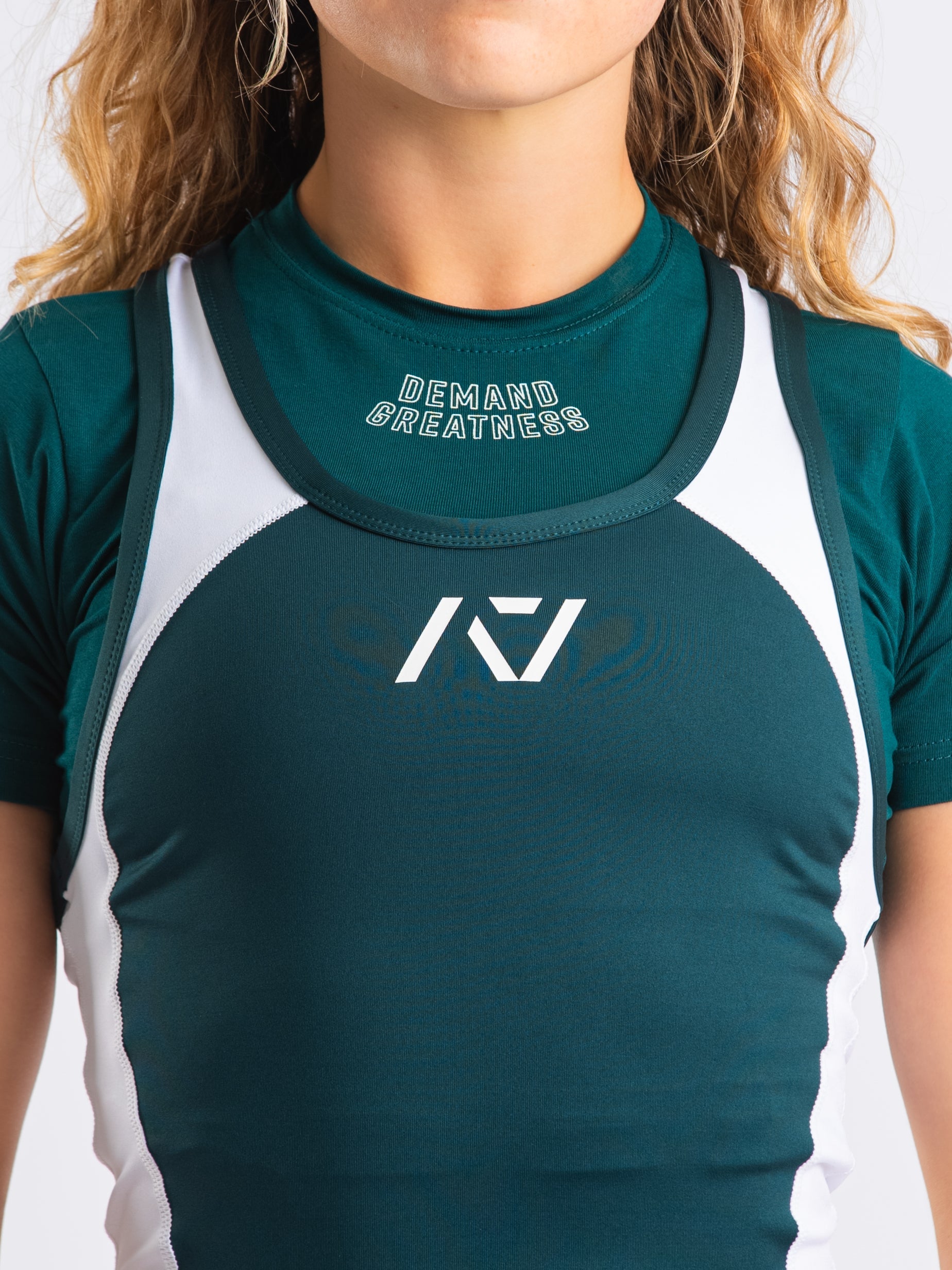 A7 IPF Approved Emerald Forás Luno singlet features extra lat mobility, side panel stitching to guide the squat depth level and curved panel design for a slimming look. The Women's cut singlet features a tapered waist and additional quad room. The IPF Approved Kit includes Luno Powerlifting Singlet, A7 Meet Shirt, A7 Zebra Wrist Wraps, A7 Deadlift Socks, Hourglass Knee Sleeves (Stiff Knee Sleeves and Rigor Mortis Knee Sleeves). All A7 Powerlifting Equipment shipping to UK, Norway, Switzerland and Iceland.