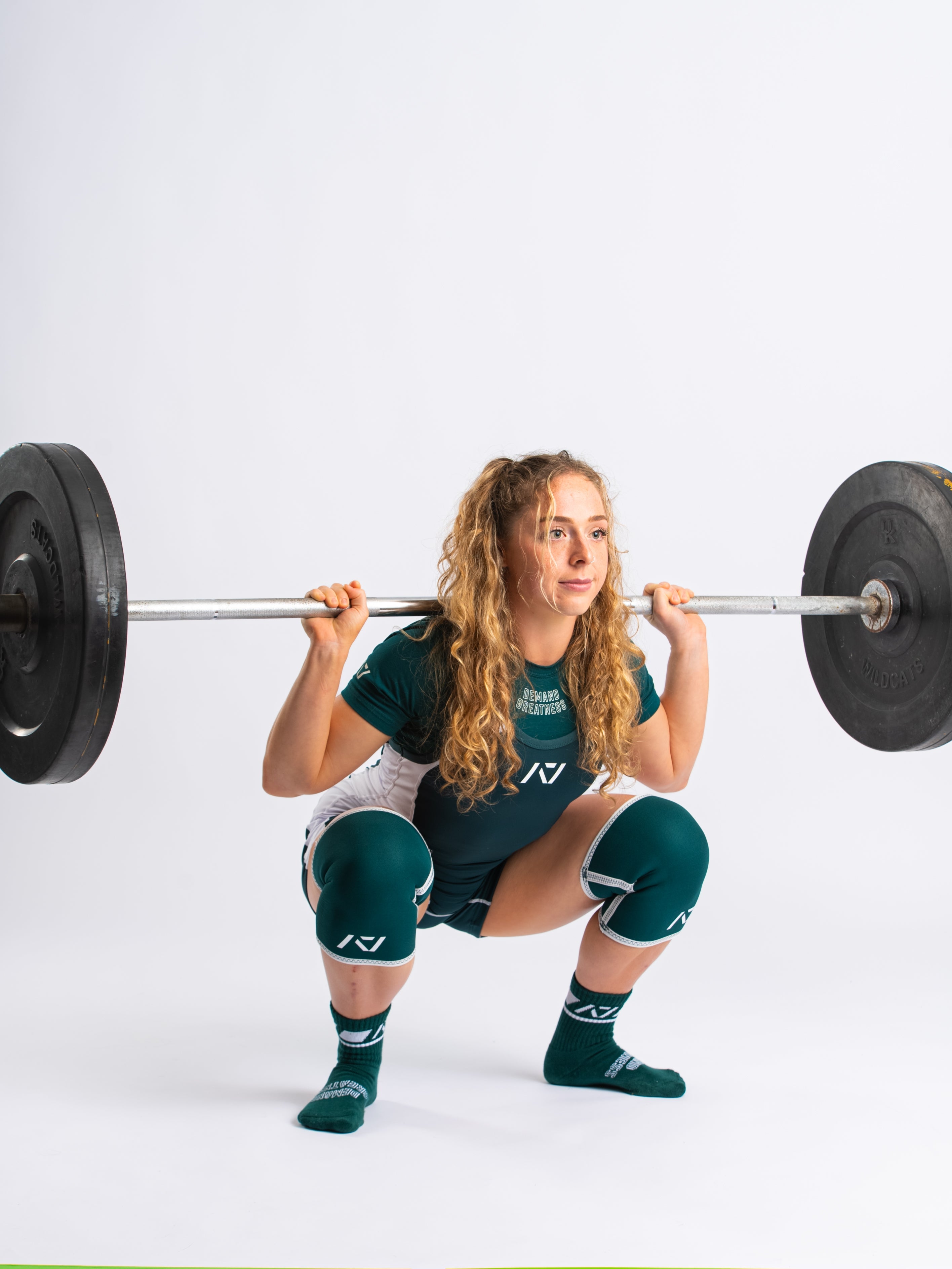 A7 IPF Approved Emerald Forás Luno singlet features extra lat mobility, side panel stitching to guide the squat depth level and curved panel design for a slimming look. The Women's cut singlet features a tapered waist and additional quad room. The IPF Approved Kit includes Luno Powerlifting Singlet, A7 Meet Shirt, A7 Zebra Wrist Wraps, A7 Deadlift Socks, Hourglass Knee Sleeves (Stiff Knee Sleeves and Rigor Mortis Knee Sleeves). All A7 Powerlifting Equipment shipping to UK, Norway, Switzerland and Iceland.