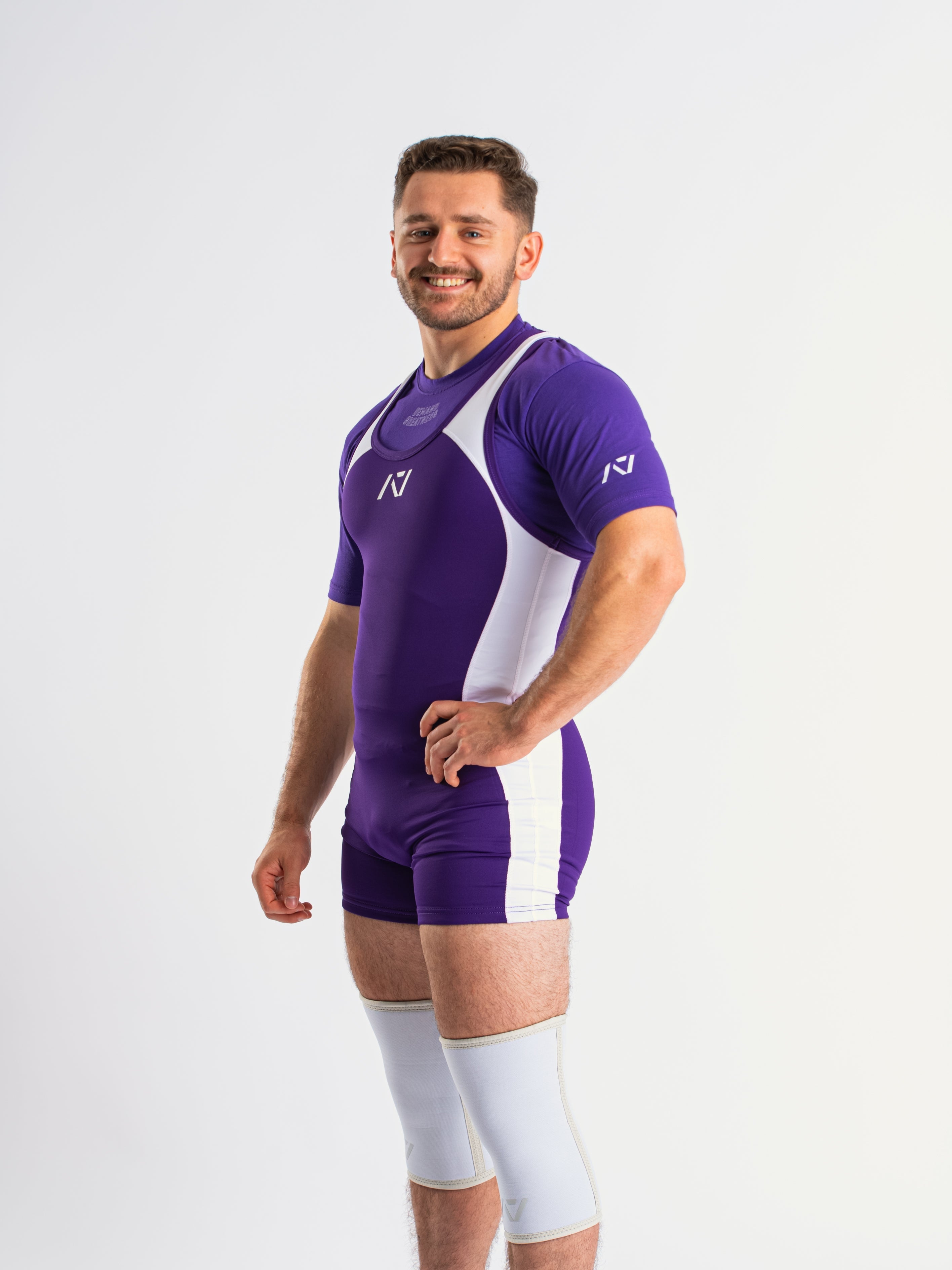 A7 IPF Approved Purple Luno singlet features extra lat mobility, side panel stitching to guide the squat depth level and curved panel design for a slimming look. The Women's cut singlet features a tapered waist and additional quad room. The IPF Approved Kit includes Luno Powerlifting Singlet, A7 Meet Shirt, A7 Zebra Wrist Wraps, A7 Deadlift Socks, Hourglass Knee Sleeves (Stiff Knee Sleeves and Rigor Mortis Knee Sleeves). All A7 Powerlifting Equipment shipping to UK, Norway, Switzerland and Iceland.