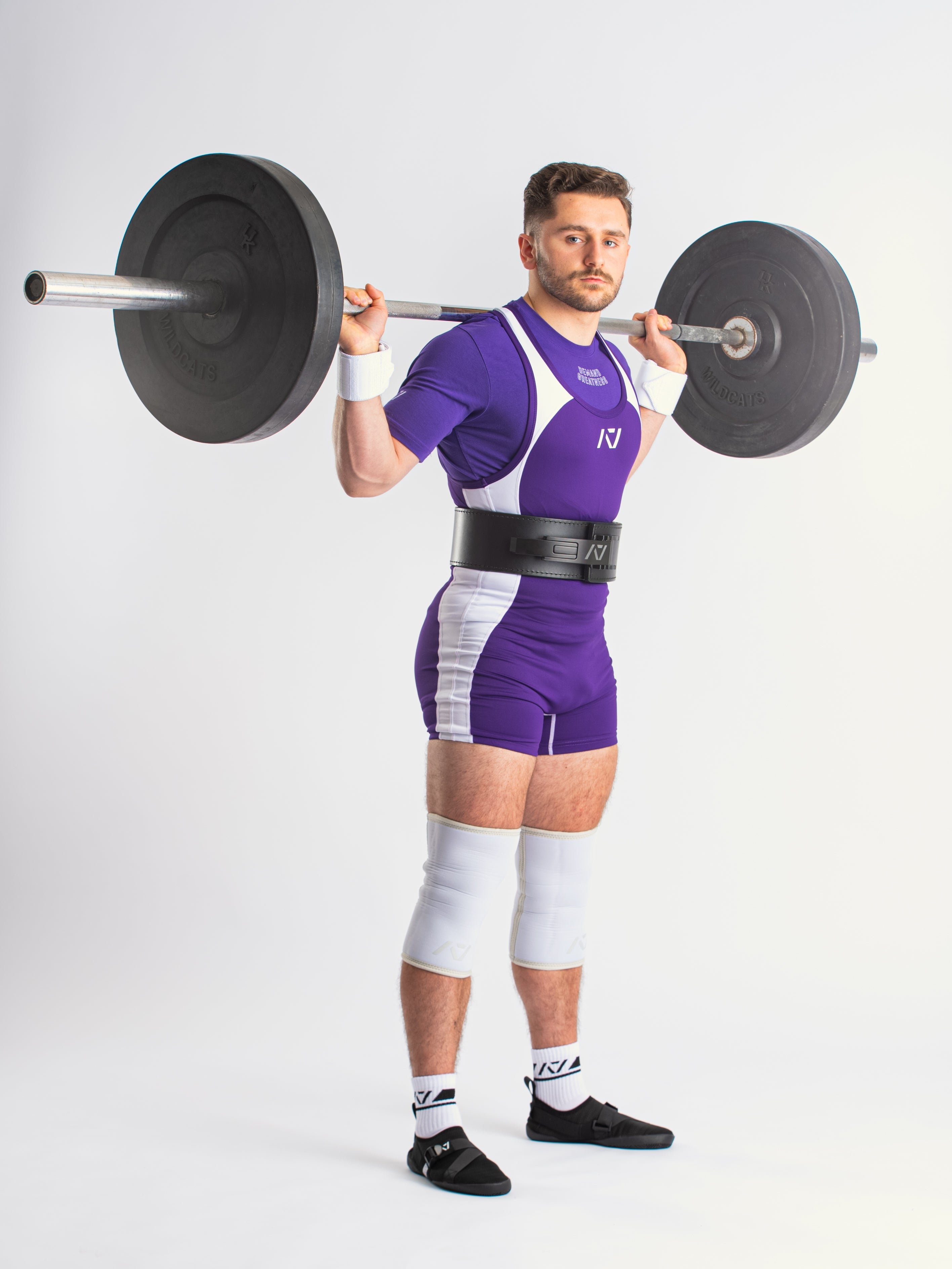 A7 IPF Approved Purple Luno singlet features extra lat mobility, side panel stitching to guide the squat depth level and curved panel design for a slimming look. The Women's cut singlet features a tapered waist and additional quad room. The IPF Approved Kit includes Luno Powerlifting Singlet, A7 Meet Shirt, A7 Zebra Wrist Wraps, A7 Deadlift Socks, Hourglass Knee Sleeves (Stiff Knee Sleeves and Rigor Mortis Knee Sleeves). All A7 Powerlifting Equipment shipping to UK, Norway, Switzerland and Iceland.