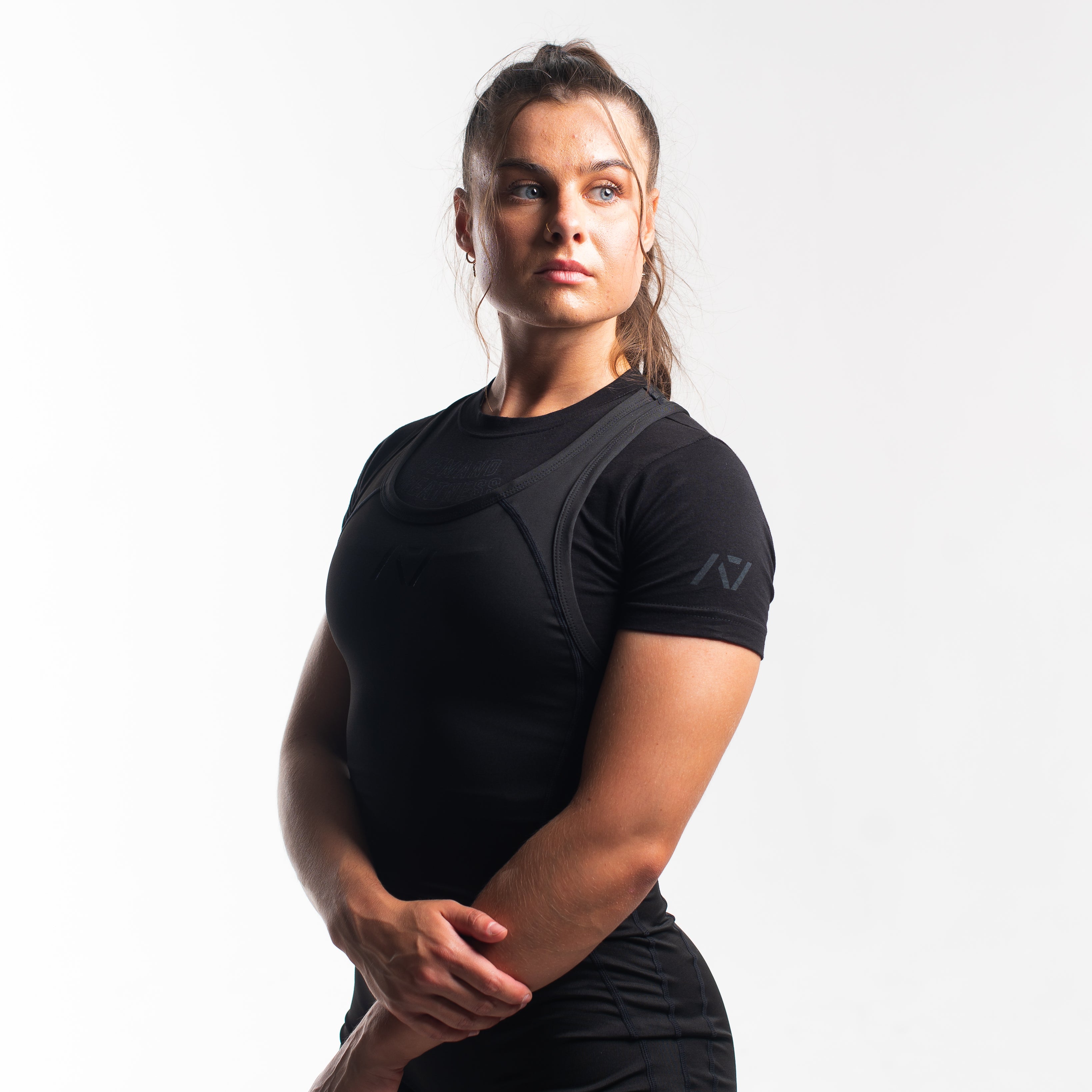 A7 IPF Approved Stealth Luno singlet features extra lat mobility, side panel stitching to guide the squat depth level and curved panel design for a slimming look. The Women's cut singlet features a tapered waist and additional quad room. The IPF Approved Kit includes Luno Powerlifting Singlet, A7 Meet Shirt, A7 Zebra Wrist Wraps, A7 Deadlift Socks, Hourglass Knee Sleeves (Stiff Knee Sleeves and Rigor Mortis Knee Sleeves). All A7 Powerlifting Equipment shipping to UK, Norway, Switzerland and Iceland.