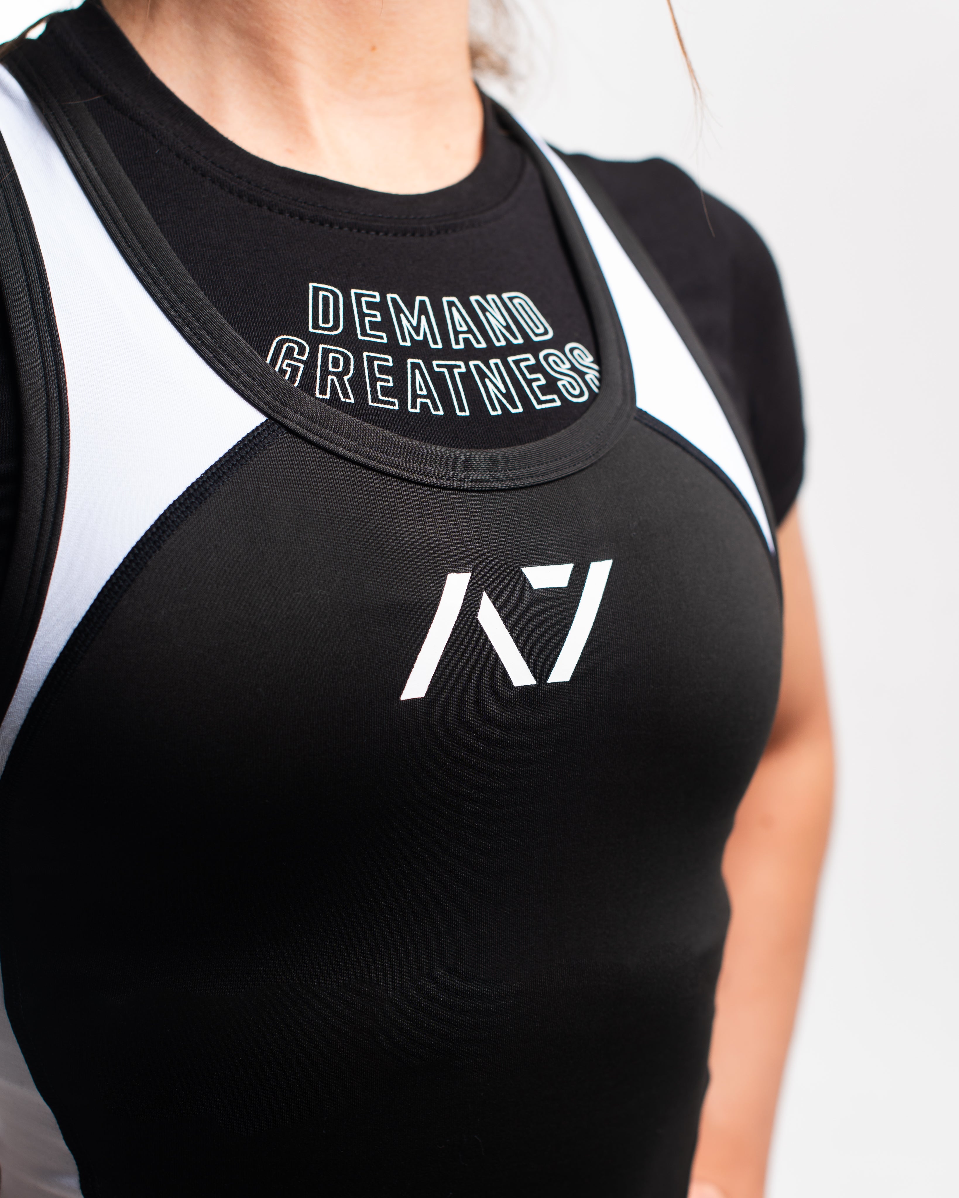 A7 IPF Approved Domino Luno singlet features extra lat mobility, side panel stitching to guide the squat depth level and curved panel design for a slimming look. The Women's cut singlet features a tapered waist and additional quad room. The IPF Approved Kit includes Luno Powerlifting Singlet, A7 Meet Shirt, A7 Zebra Wrist Wraps, A7 Deadlift Socks, Hourglass Knee Sleeves (Stiff Knee Sleeves and Rigor Mortis Knee Sleeves). All A7 Powerlifting Equipment shipping to UK, Norway, Switzerland and Iceland.