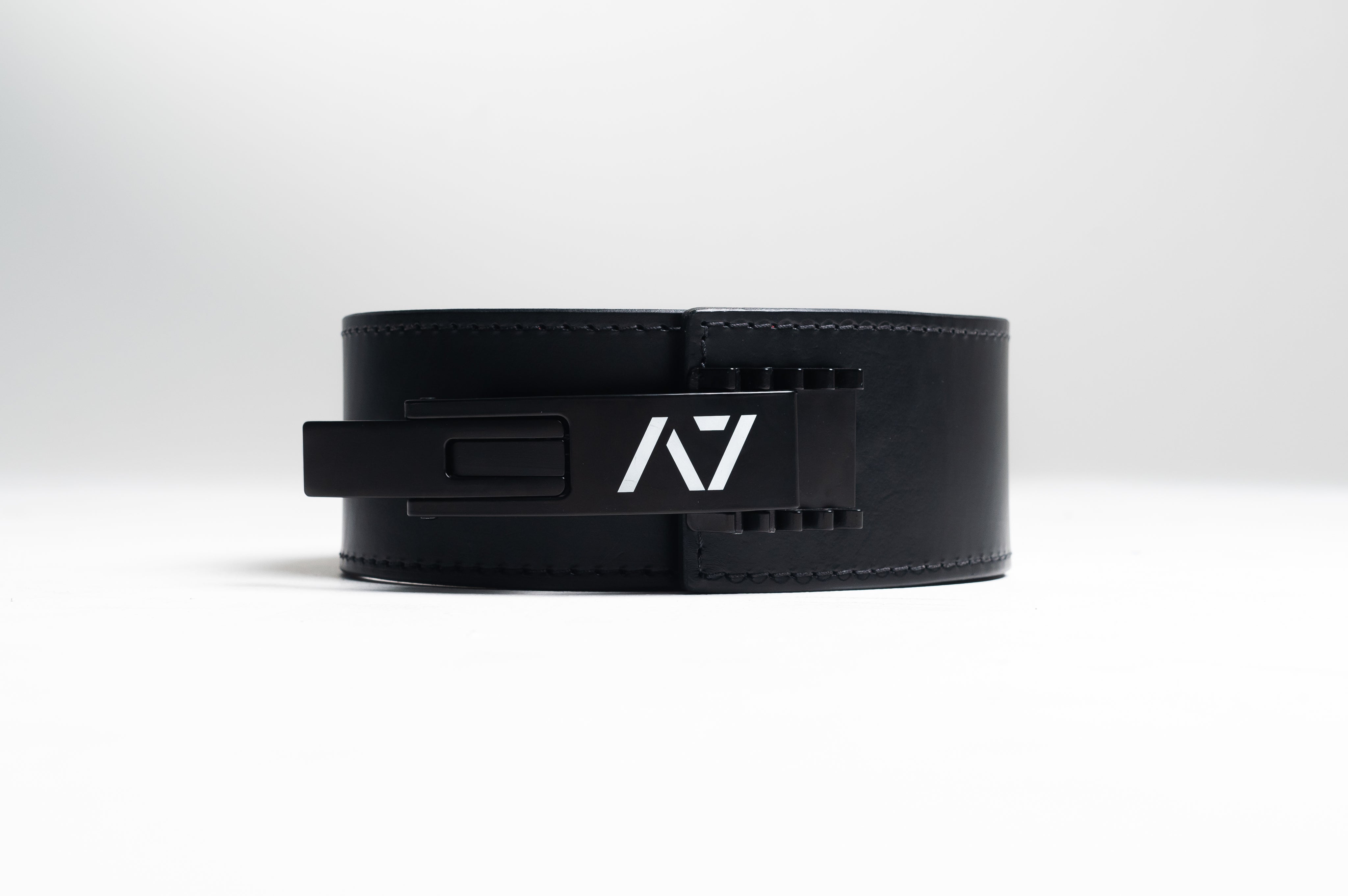 A7 IPF Approved PAL Lever Belt features a black design with black leather, black engraved buckle and debossed A7 logo on the leather. The new Pioneer Adjustable Lever, PAL, buckle allows you to quickly adjust the tightness of your belt for a perfect fit. The IPF Approved Kit includes Singlet, A7 Meet Shirt, A7 Zebra Wrist Wraps, A7 Deadlift Socks, Hourglass Knee Sleeves (Stiff Knee Sleeves and Rigor Mortis Knee Sleeves). All A7 Powerlifting Equipment shipping to UK, Norway, Switzerland and Iceland.