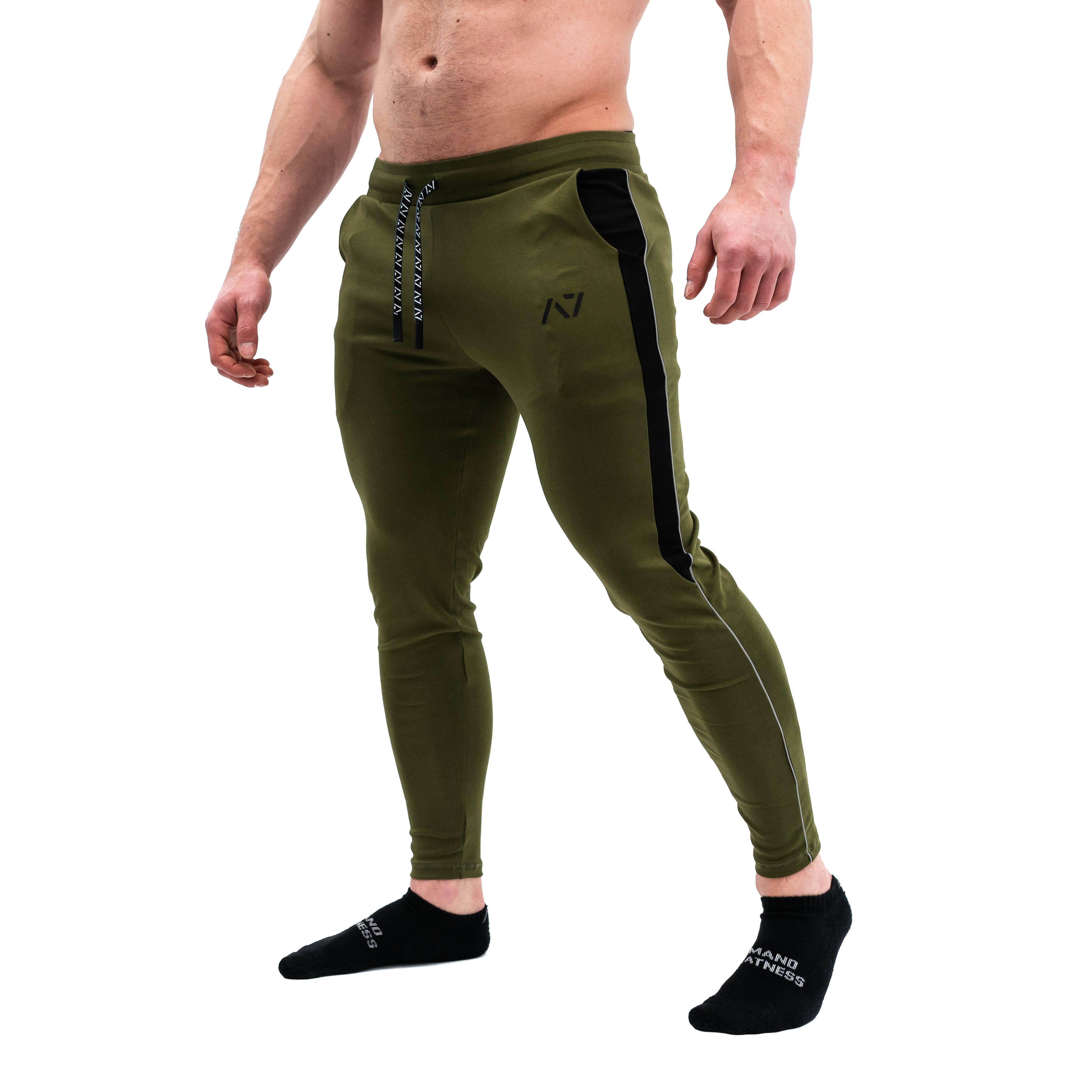 Our Moxie Joggers are made with premium cotton spandex fabric to keep you comfy throughout the day whether you are training or going out! Our Moxie Joggers contour to your body and feature a reflective stripe on both side, deep un-zippered pockets and stealth matte logos. Now in our new military colourway. You can purchase Military Moxie joggers from A7 UK or A7 Europe. A7 UK shipping to UK, Ireland, France, Italy, Germany, the Netherlands, Sweden and Poland.