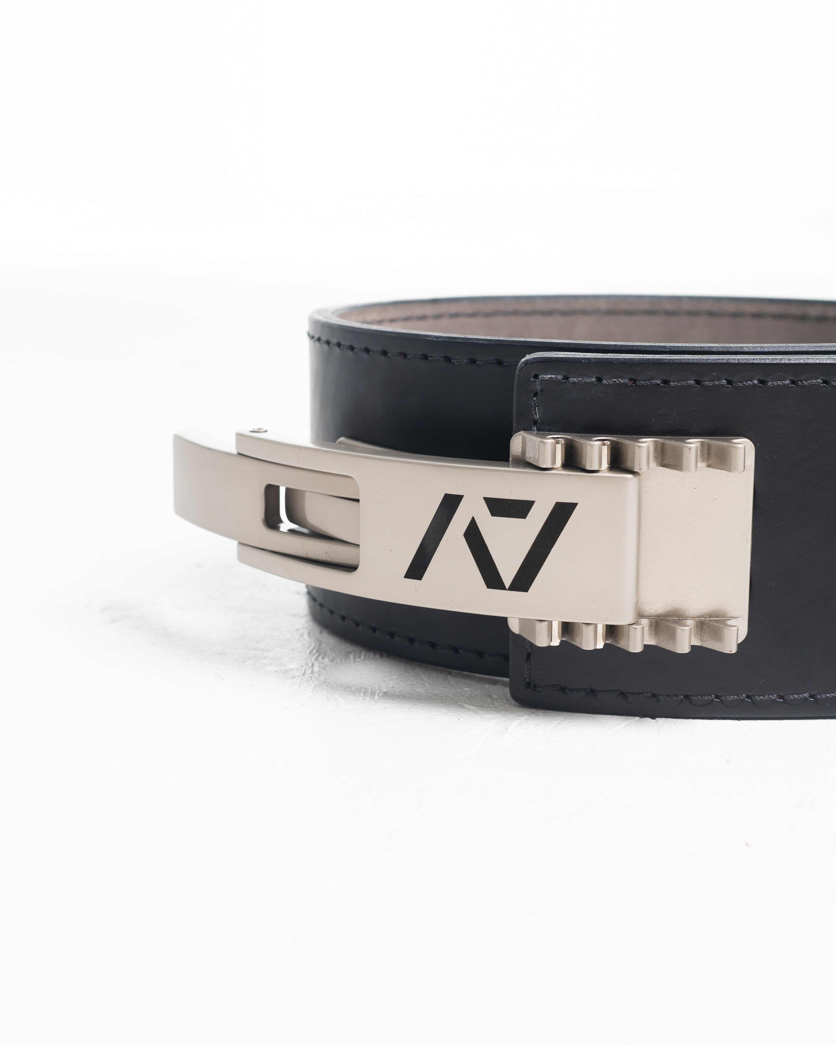 A7 IPF Approved Lever Belt features a black design with black leather, silver engraved buckle and debossed A7 logo on the leather. The new Pioneer Adjustable Lever, PAL, buckle allows you to quickly adjust the tightness of your belt for a perfect fit. The IPF Approved Kit includes Singlet, A7 Meet Shirt, A7 Zebra Wrist Wraps, A7 Deadlift Socks, Hourglass Knee Sleeves (Stiff Knee Sleeves and Rigor Mortis Knee Sleeves). All A7 Powerlifting Equipment shipping to UK, Norway, Switzerland and Iceland.