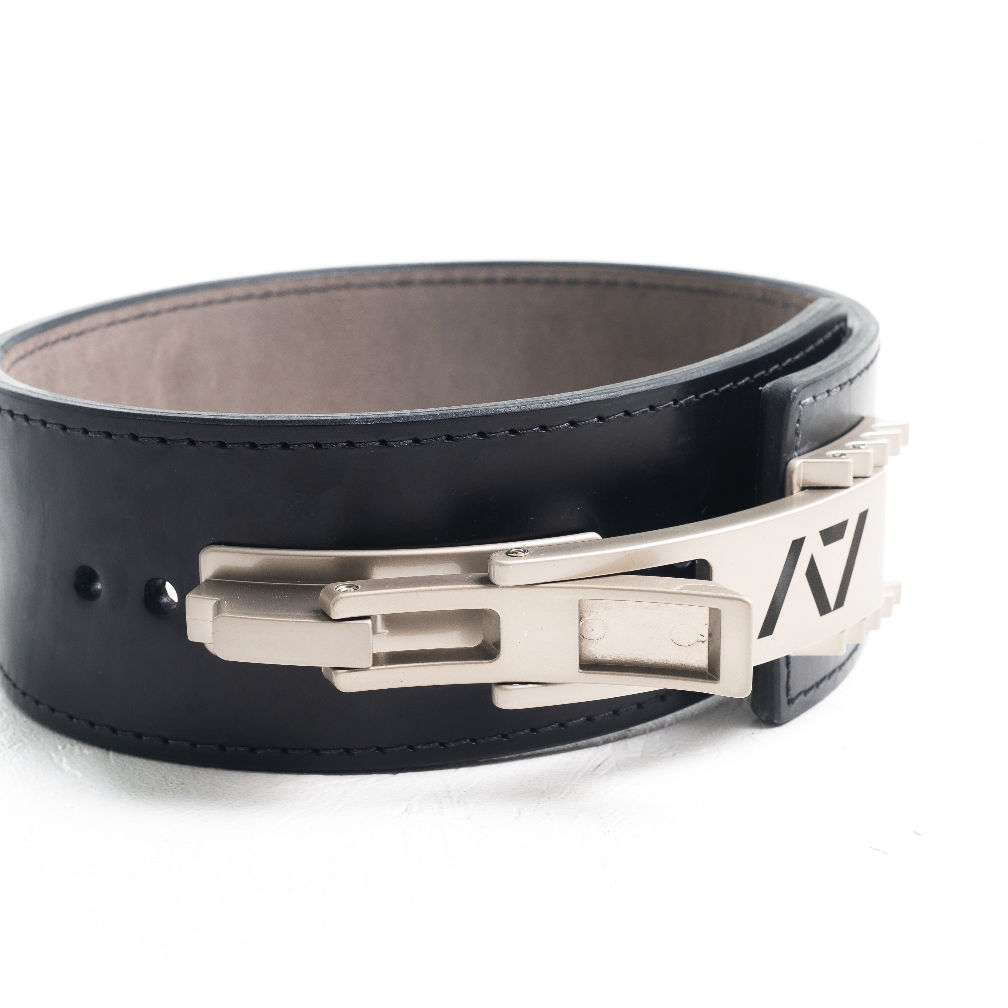 A7 IPF Approved PAL Lever Belt features a black design with black leather, black engraved buckle and debossed A7 logo on the leather. The new Pioneer Adjustable Lever, PAL, buckle allows you to quickly adjust the tightness of your belt for a perfect fit. The IPF Approved Kit includes Singlet, A7 Meet Shirt, A7 Zebra Wrist Wraps, A7 Deadlift Socks, Hourglass Knee Sleeves (Stiff Knee Sleeves and Rigor Mortis Knee Sleeves). All A7 Powerlifting Equipment shipping to UK, Norway, Switzerland and Iceland.