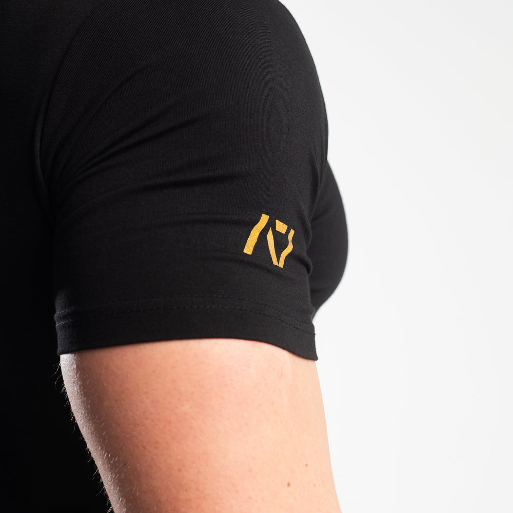 
                      
                        DG23 Gold Standard is our new meet shirt design highlighting Demand Greatness with a double outline font to showcase your impact on the platform. The DG23 Meet Shirt is IPF Approved. Shop the full A7 Powerlifting IPF Approved Equipment collection. The IPF Approved Kit includes Powerlifting Singlet, A7 Meet Shirt, A7 Zebra Wrist Wraps, A7 Deadlift Socks, Hourglass Knee Sleeves (Stiff Knee Sleeves and Rigor Mortis Knee Sleeves). All A7 Powerlifting Equipment shipping to UK, Norway, Switzerland and Iceland. 
                      
                    