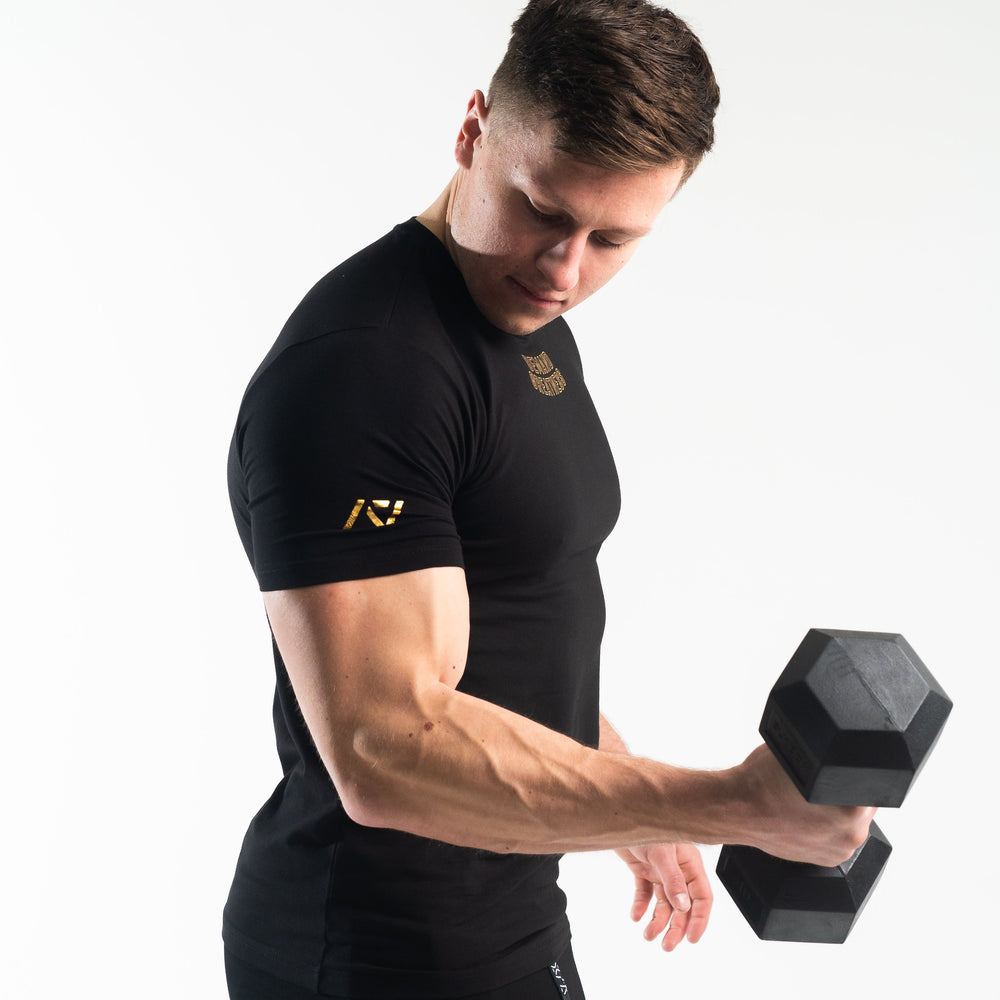 
                      
                        DG23 Gold Standard is our new meet shirt design highlighting Demand Greatness with a double outline font to showcase your impact on the platform. The DG23 Meet Shirt is IPF Approved. Shop the full A7 Powerlifting IPF Approved Equipment collection. The IPF Approved Kit includes Powerlifting Singlet, A7 Meet Shirt, A7 Zebra Wrist Wraps, A7 Deadlift Socks, Hourglass Knee Sleeves (Stiff Knee Sleeves and Rigor Mortis Knee Sleeves). All A7 Powerlifting Equipment shipping to UK, Norway, Switzerland and Iceland. 
                      
                    