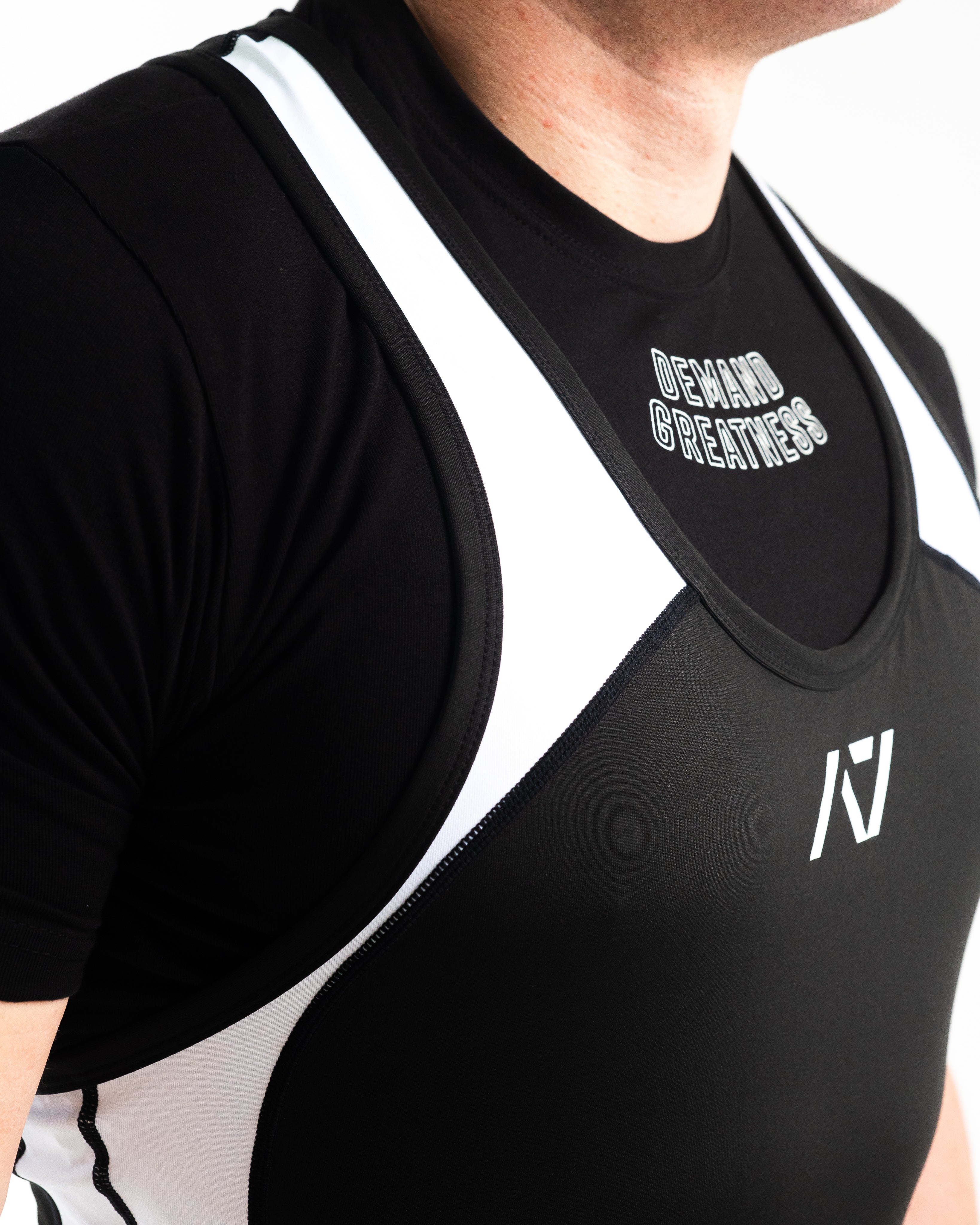 A7 IPF Approved Domino Luno singlet features extra lat mobility, side panel stitching to guide the squat depth level and curved panel design for a slimming look. The Women's cut singlet features a tapered waist and additional quad room. The IPF Approved Kit includes Luno Powerlifting Singlet, A7 Meet Shirt, A7 Zebra Wrist Wraps, A7 Deadlift Socks, Hourglass Knee Sleeves (Stiff Knee Sleeves and Rigor Mortis Knee Sleeves). All A7 Powerlifting Equipment shipping to UK, Norway, Switzerland and Iceland.