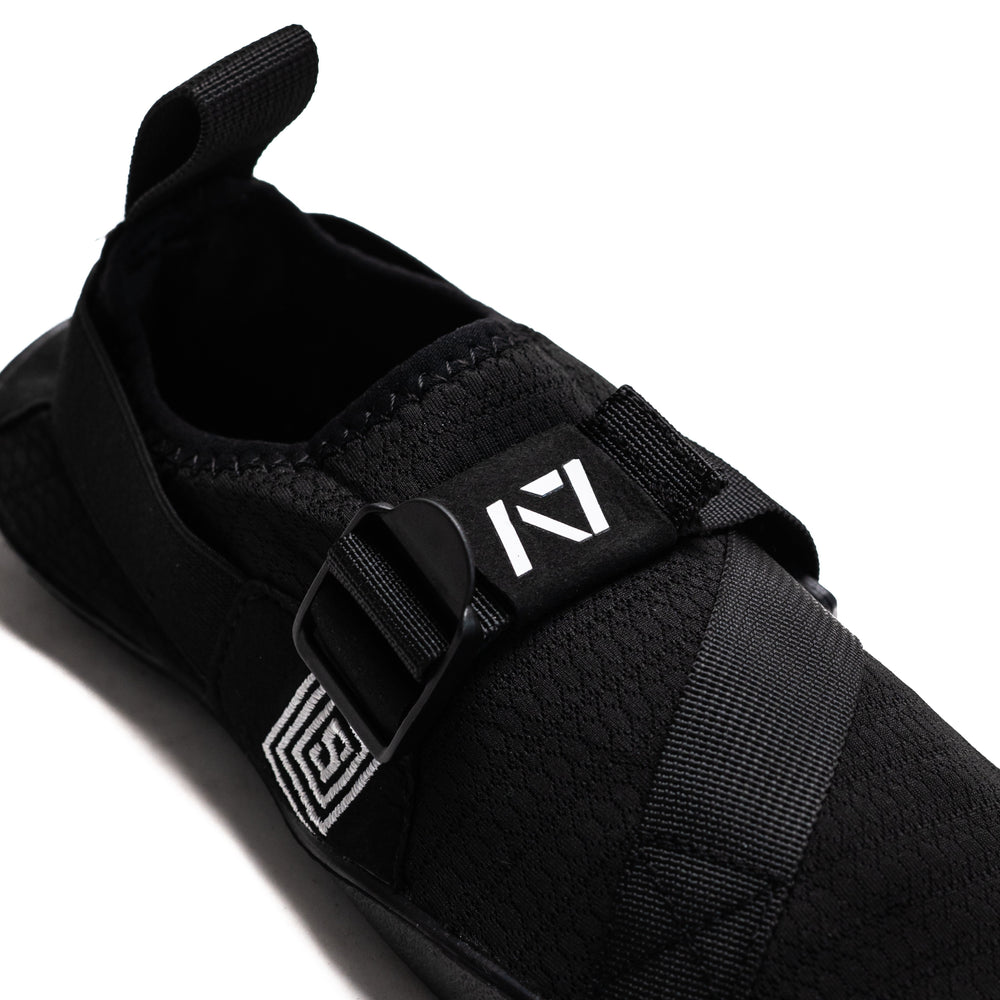 
                      
                        Simply designed with you in mind. With a 5 mm thin rubber grip sole, single pull diagonal/ Centre tension strap, all plastic components to allow easy washing, and even a convenient storage bag. These Soul Sumo v2 slippers are sure to impress. These slippers are ultra-compact and when rolled up are about the size of your wrist wraps. Our Soul Sumo Slippers are approved for IPF competitions and make a great addition to any IPF approved kit! A7 UK shipping to UK and Europe.
                      
                    