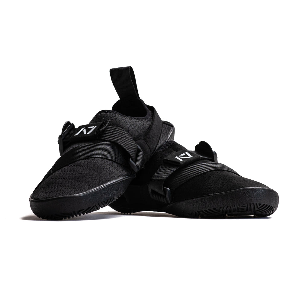 
                      
                        Simply designed with you in mind. With a 5 mm thin rubber grip sole, single pull diagonal/ Centre tension strap, all plastic components to allow easy washing, and even a convenient storage bag. These Soul Sumo v2 slippers are sure to impress. These slippers are ultra-compact and when rolled up are about the size of your wrist wraps. Our Soul Sumo Slippers are approved for IPF competitions and make a great addition to any IPF approved kit! A7 UK shipping to UK and Europe.
                      
                    