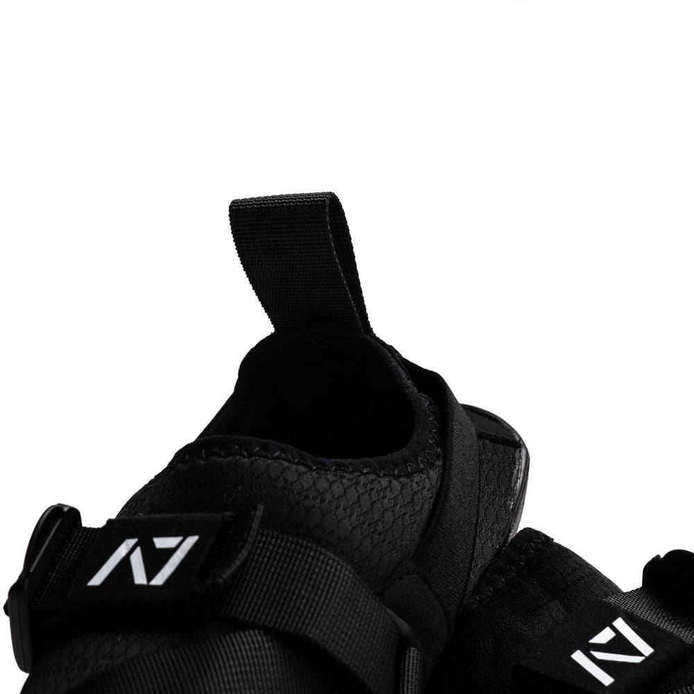 
                      
                        Simply designed with you in mind. With a 5 mm thin rubber grip sole, single pull diagonal/ Centre tension strap, all plastic components to allow easy washing, and even a convenient storage bag. These Soul Sumo v2 slippers are sure to impress. These slippers are ultra-compact and when rolled up are about the size of your wrist wraps. Our Soul Sumo Slippers are approved for IPF competitions and make a great addition to any IPF approved kit! A7 UK shipping to UK and Europe.
                      
                    