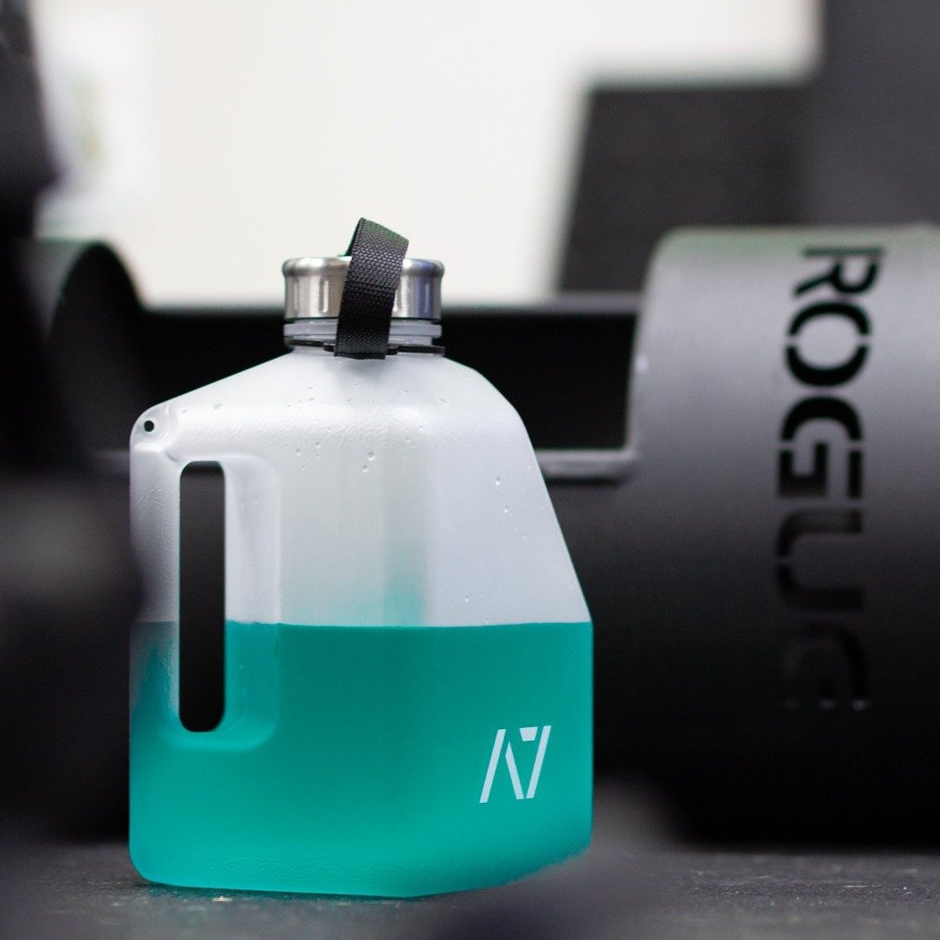 Stay hydrated during your workout with an A7 Water Jug. The jug is great for long workouts. It features a magnetic phone attachment so you can keep your phone close while you workout.  Simply stick the magnet on the back of the phone and pop the phone onto the bottle and your are ready to record your next set or even watch a video.