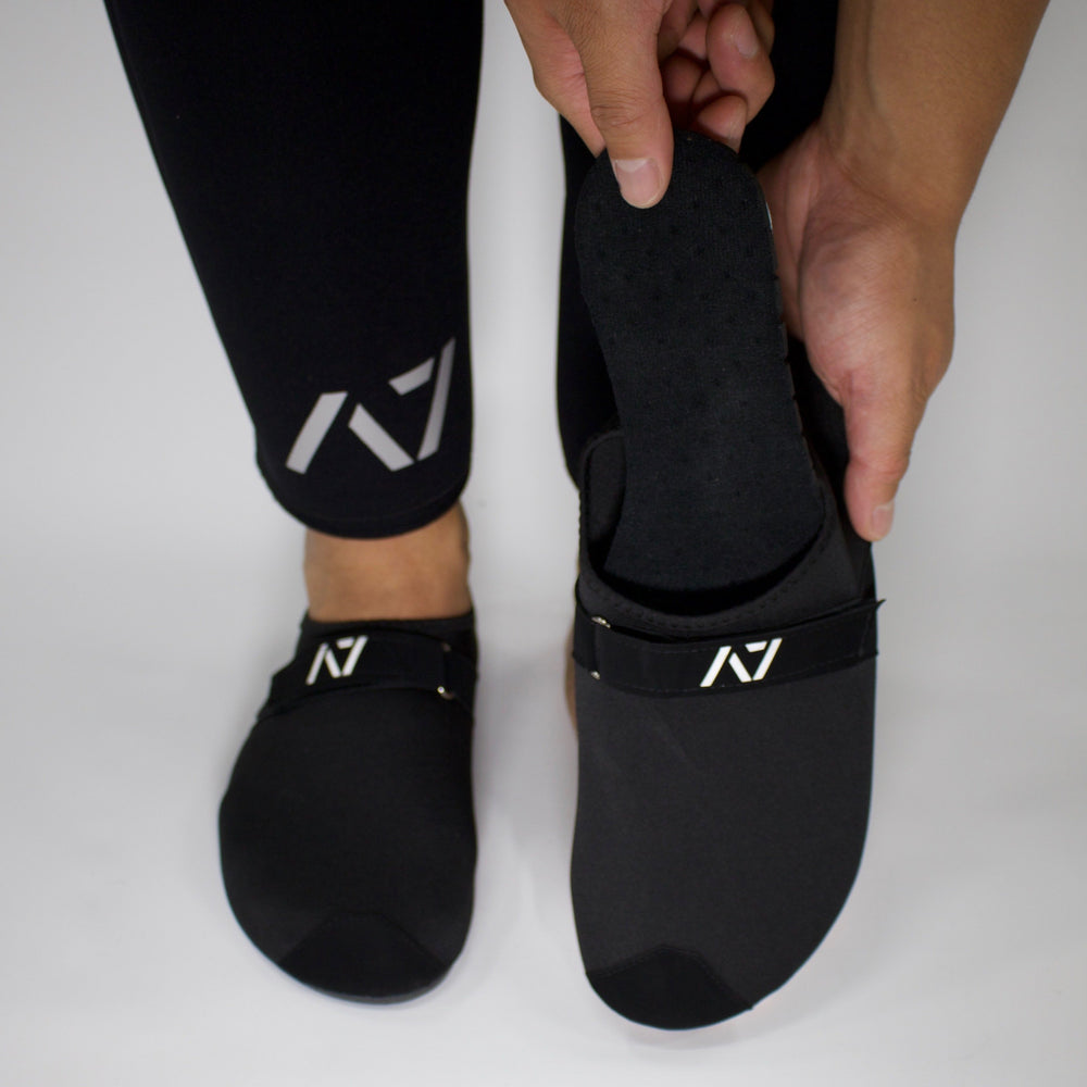 
                      
                        A7 Deadlift slippers easy to slip on and off and get close to the ground. IPF approved deadlift slippers. Deadlift slippers with a 3mm sole that can be used for squats, bench, deadlift or just lounging around the house. The best Powerlifting apparel and clothes for all your workouts, shipping to UK and Europe from A7 UK. Deadlift slippers. Soul Go slippers are the perfect IPF approved kit for IPF competitions. Available in UK and Europe including France, Italy, Germany, Sweden and Poland
                      
                    