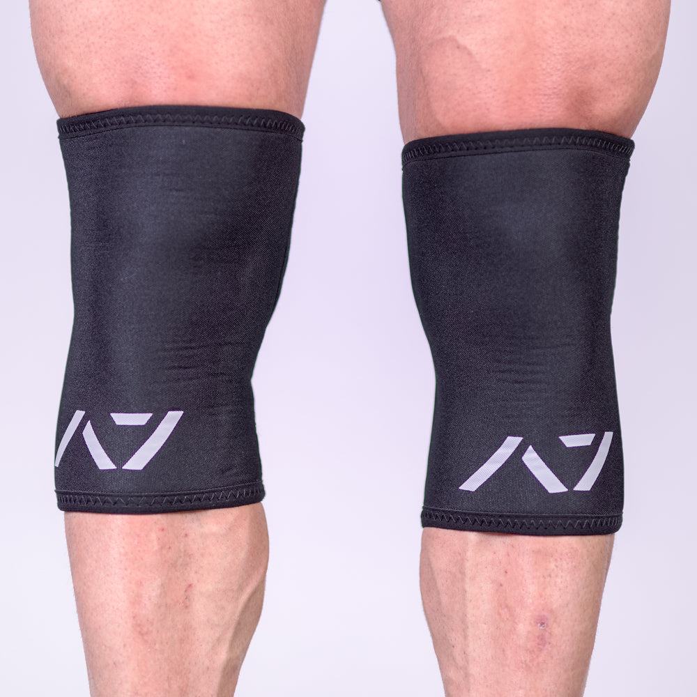 A7 IPF approved Black CONE knee sleeves are structured with a downward cut panel on the back of the quad and calf to ensure ultimate compression at the knee joint. A7 CONE knee sleeves are IPF approved for use in all powerlifting competitions. A7 CONE Knee Sleeves are IPF Approved Kit. A7 cone knee sleeves are made with high quality neoprene and the knee sleeves are sold as a pair. The double seam on the knee sleeves create a greater tension on the knee joint. A7 UK shipping to UK and Europe. 