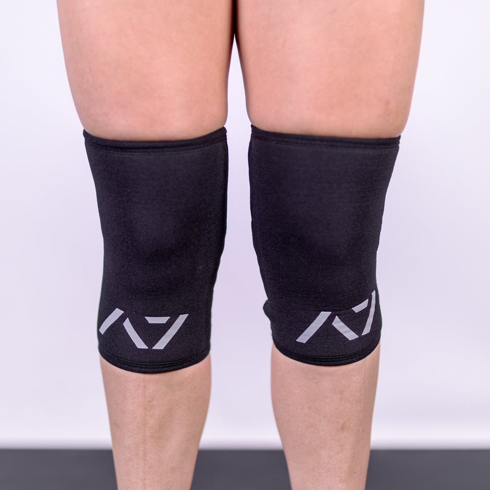 A7 IPF approved Black CONE knee sleeves are structured with a downward cut panel on the back of the quad and calf to ensure ultimate compression at the knee joint. A7 CONE knee sleeves are IPF approved for use in all powerlifting competitions. A7 CONE Knee Sleeves are IPF Approved Kit. A7 cone knee sleeves are made with high quality neoprene and the knee sleeves are sold as a pair. The double seam on the knee sleeves create a greater tension on the knee joint. A7 UK shipping to UK and Europe. 