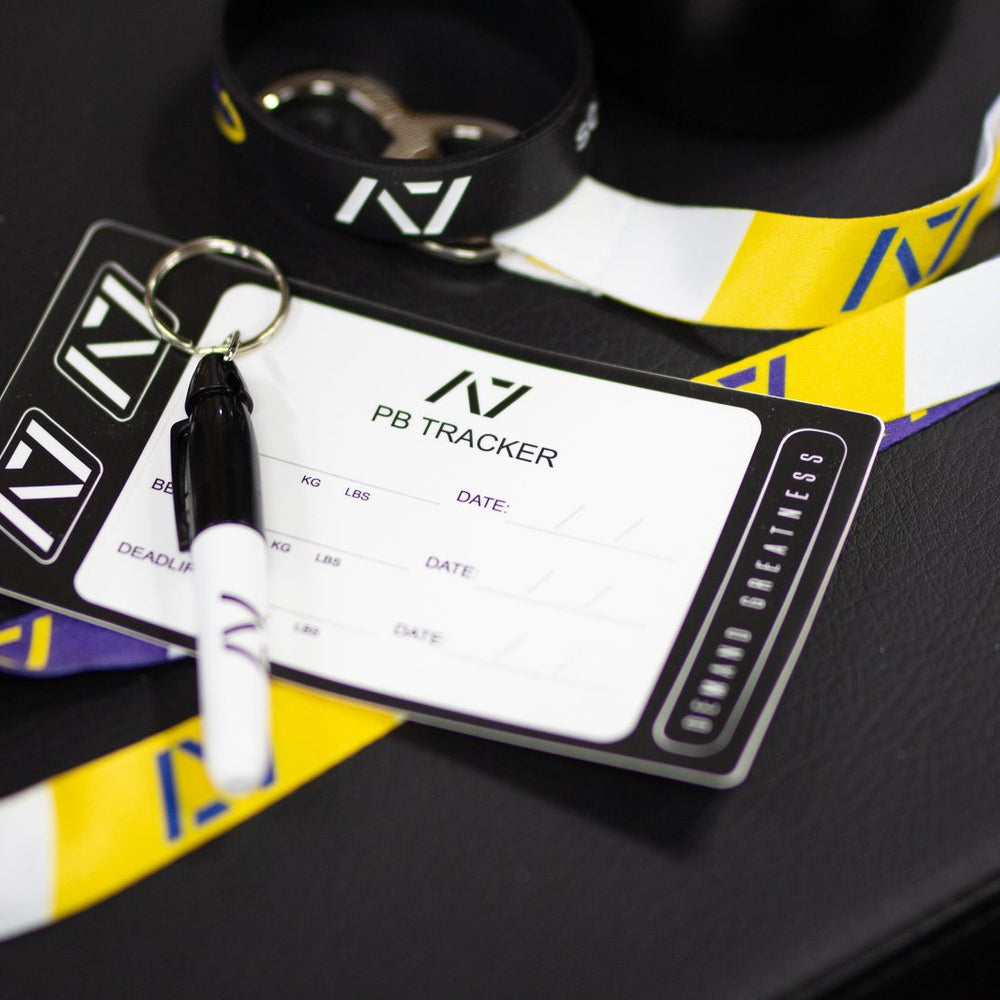 
                      
                        A7 PB Tracker sheet was designed to allow you to document your PRs and progress in your training of Squat, Bench and Deadlift in a convenient sheet that you can attach to your belt, your gym banner or even your home gym wall. It include a small A7 Permanent marker with a keyring to help document our success along with 2 A7 stickers and 1 Demand Greatness sticker.
                      
                    