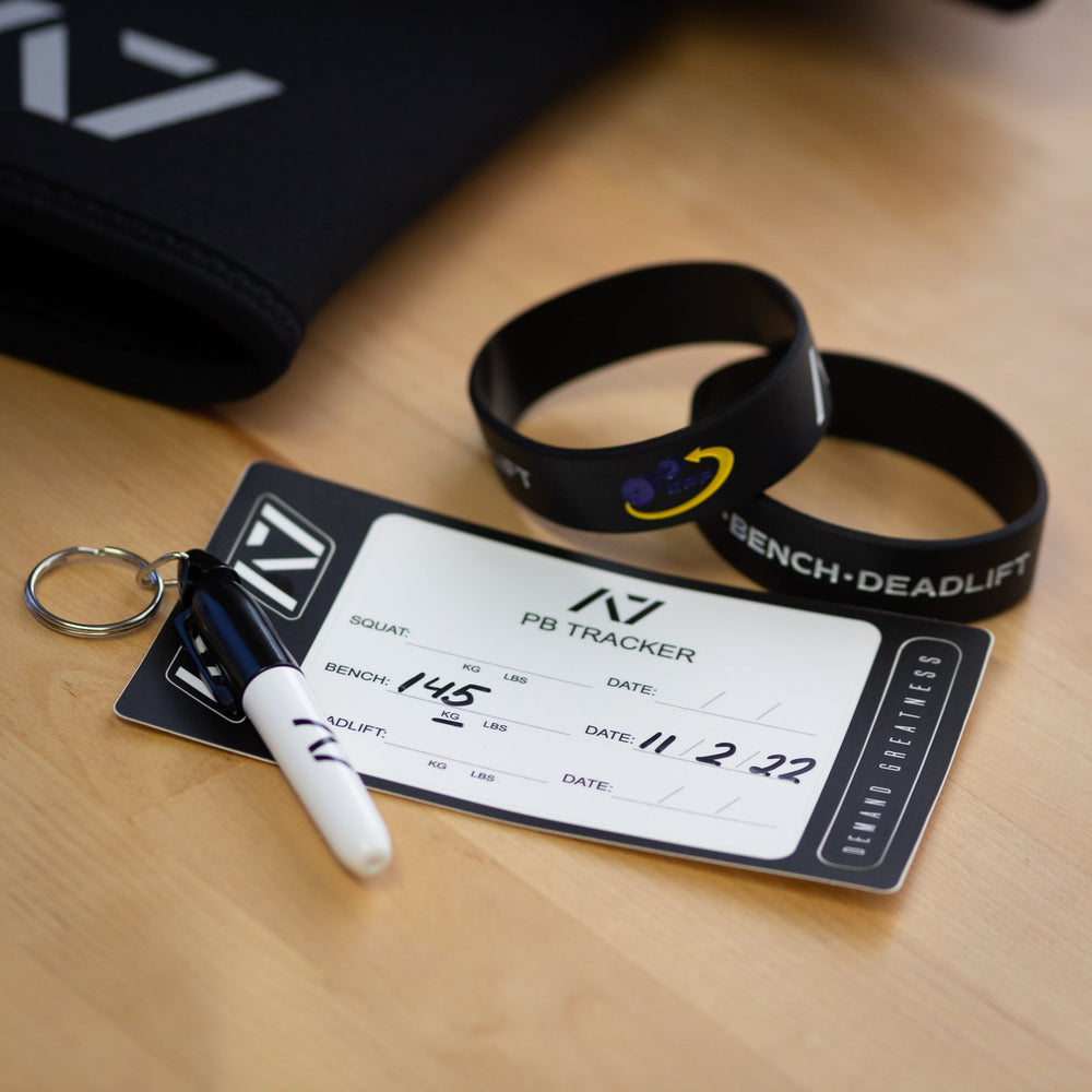 
                      
                        A7 PB Tracker sheet was designed to allow you to document your PRs and progress in your training of Squat, Bench and Deadlift in a convenient sheet that you can attach to your belt, your gym banner or even your home gym wall. It include a small A7 Permanent marker with a keyring to help document our success along with 2 A7 stickers and 1 Demand Greatness sticker.
                      
                    
